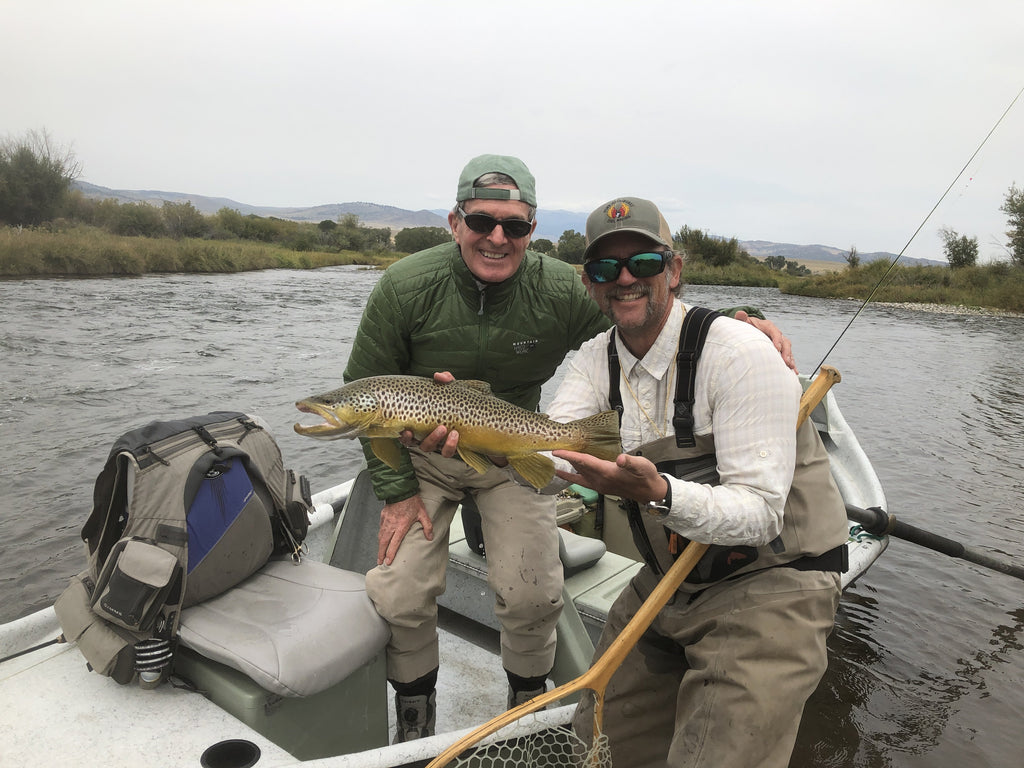 Showing off a beautiful brown trout caught streamer fishing on the Madison River near Ennis, Montana. 