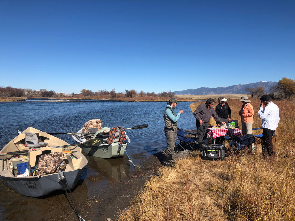 Taking a shore lunch break during a guided float fishing trip on the Madison River near Ennis, Montana.